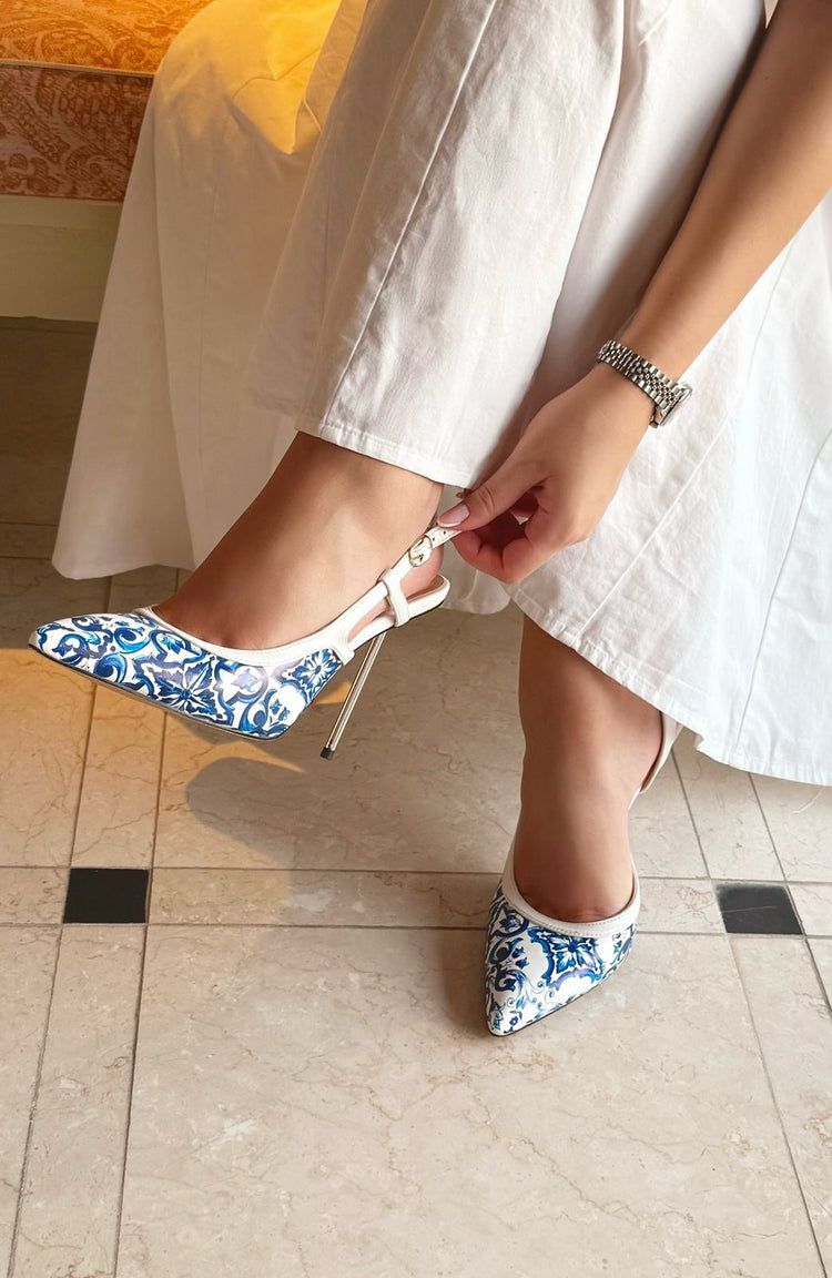 Made for the woman who commands the room — with every step, she defines rare.